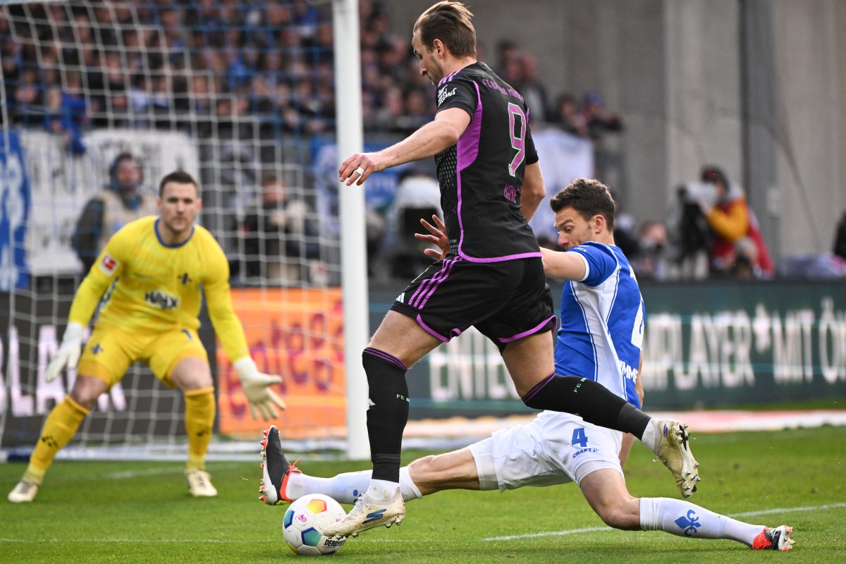 Kane breaks 60-year record and Musiala dazzles in Bayern Munich's romp 1 Bayern Munich’s English forward #09 Harry Kane gets through on goal during the German first division Bundesliga football match between SV Darmstadt 98 and FC Bayern Munich in Darmstadt, western Germany on March 16, 2024. (Photo by Kirill KUDRYAVTSEV / AFP)