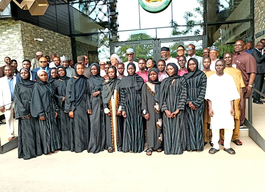National Security Adviser (NSA), Malam Nuhu Ribadu, in a group photograph with the rescued students and staff of Federal University, Gusau in Zamfara,
