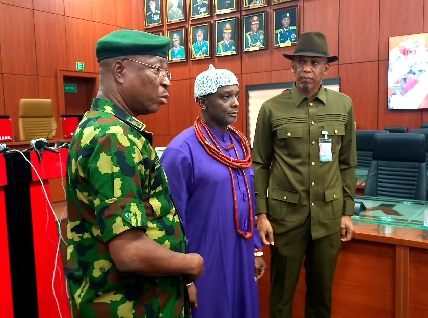 The Director, Army Public Relations, Maj.-Gen. Onyema Nwachukwu handing over the Traditional Ruler of Ewu Kingdom, HRH Clement Ikolo, who was detained in connection to killing of Army Personnel in Okuama Community in Delta, to the Senator Representing Delta Central, Sen. Ede Dafinone in Abuja on Friday (19/4/24)