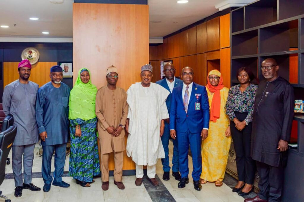Minister of Budget and Economic Planning,Senator Abubakar Atiku Bagudu(in white robes) during a courtesy by the
Director General of the Bureau of Public Enterprises (BPE), Mr.Ayodeji, Ariyo  Gbeleyi, and his management team to the minister in his office in Abuja...Wednesday.