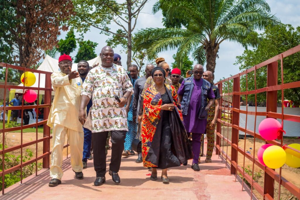 Prof Mrs Uche Amazigo leads guests on first walk on Avah Bridge after the opening