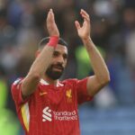 Liverpool’s Egyptian striker #11 Mohamed Salah applauds on the pitch after the English Premier League football match between Leicester City and Liverpool at King Power Stadium in Leicester, central England on April 20, 2025. (Photo by Darren Staples / AFP)