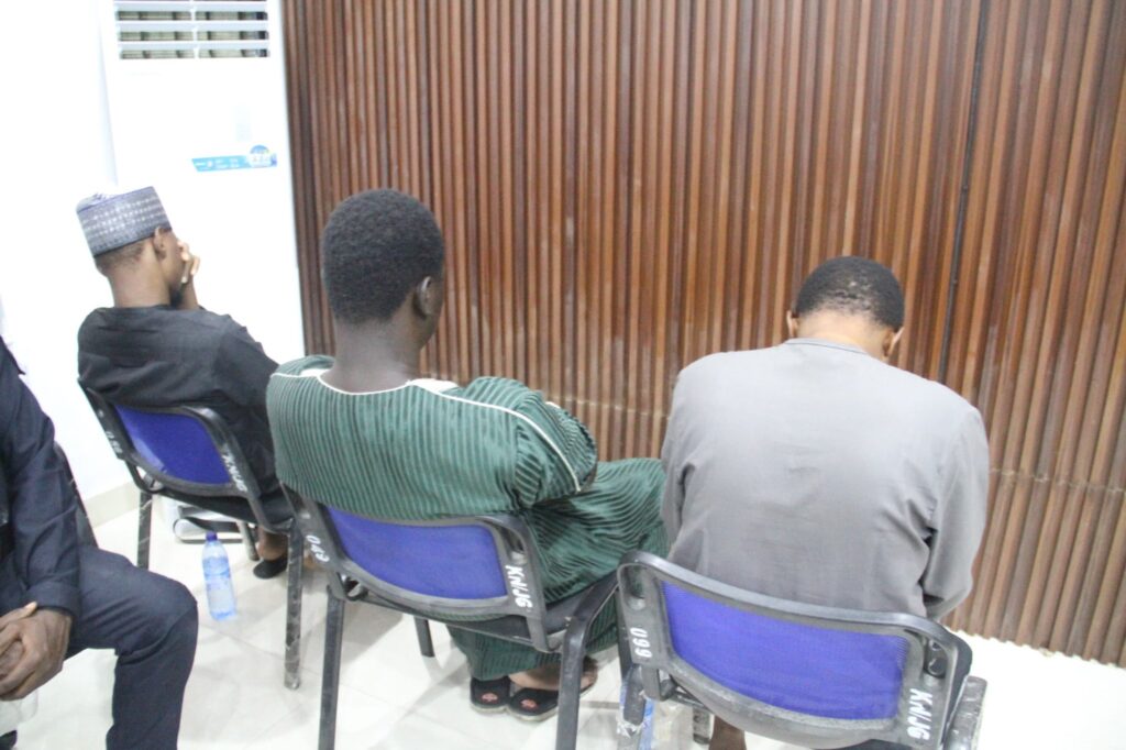 Customs Area Controller for Kano/Jigawa Area Command, Comptroller Dalhatu Abubakar, handling over the seized foreign currency to the EFCC Zonal Director of Kano Command