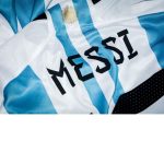 Picture Credit: https://unsplash.com/photos/a-close-up-of-a-soccer-jersey-with-the-word-messi-on-it-QG2xRapm1Kc