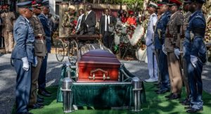 Senior military officials serving as pallbearers stand before the coffin of Kenya’s opposition leader and former Prime Minister Raila Odinga as he receives military honours during his burial ceremony in Bondo, on October 19, 2025.