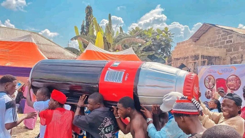 Bayelsa community buries 85-year old woman in Coca-Cola-shaped coffin This image has an empty alt attribute; its file name is Bayelsa-community-buries-woman-in-Coca-Cola-coffin3-1024x576.jpg