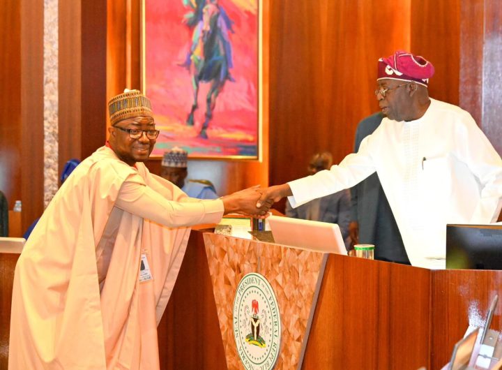 President Bola Tinubu in a handshake with the Minister of Humanitarian Affairs, Bernard Doro, shortly after the swearing in ceremony. Photo credit: State House