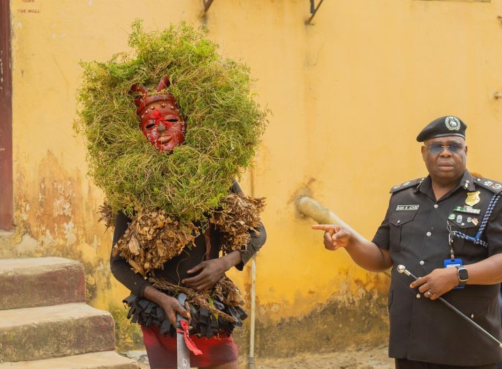Akwa Ibom State Commissioner of Police CP Baba Azare with suspected masquerade arrested in Uyo