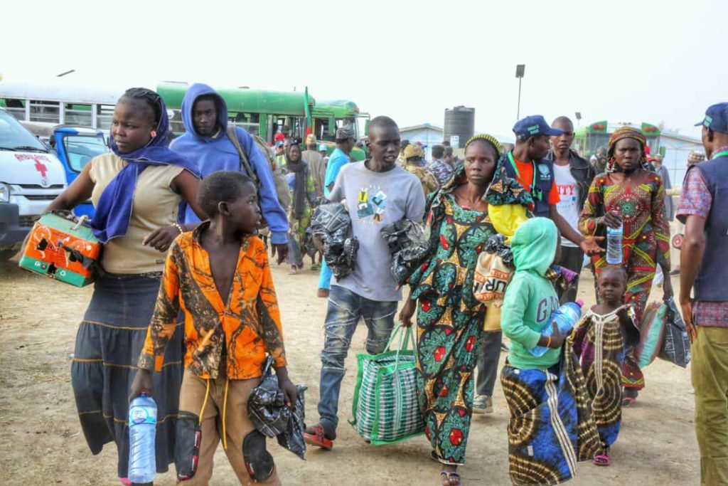 First batch of 300 Nigerian refugees returns to Gwoza in landmark homecoming 1 First batch of 300 Nigerian refugees returns to Gwoza in landmark homecoming