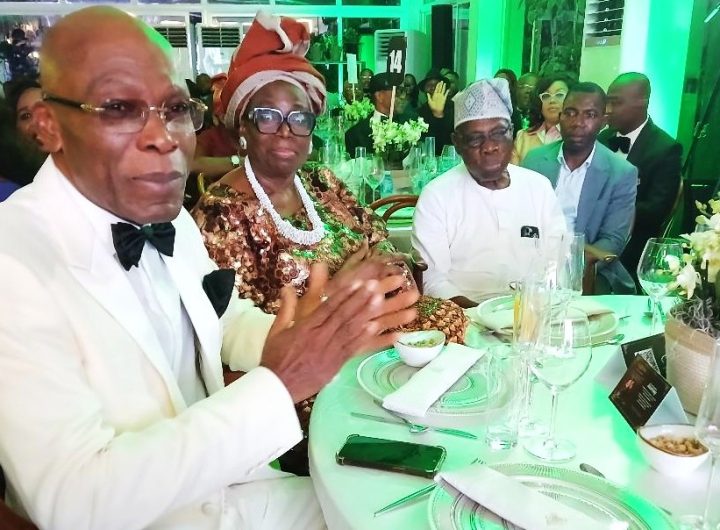 R L President Olusegun Obasanjo his wife Chief Mrs Bola Obasanjo and Mr. Leo Stan Ekeh at the event