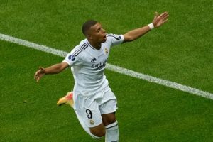 Real Madrid’s French forward #09 Kylian Mbappe celebrates